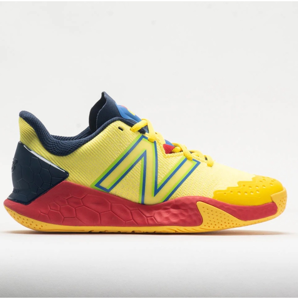 New balance fresh foam lav court shoes.yellow with bops of red and navy.